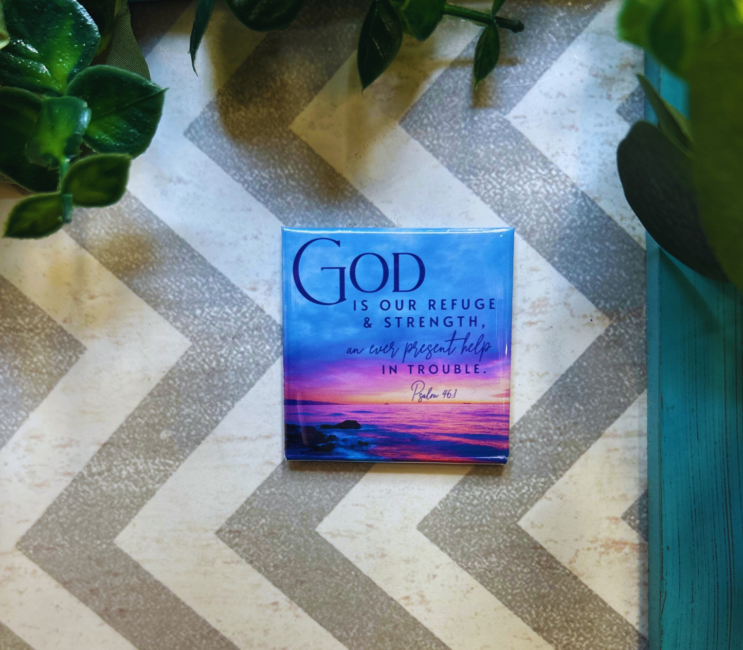 Scripture design drop refrigerator magnet with 'God is our refuge & strength' text on beach landscape