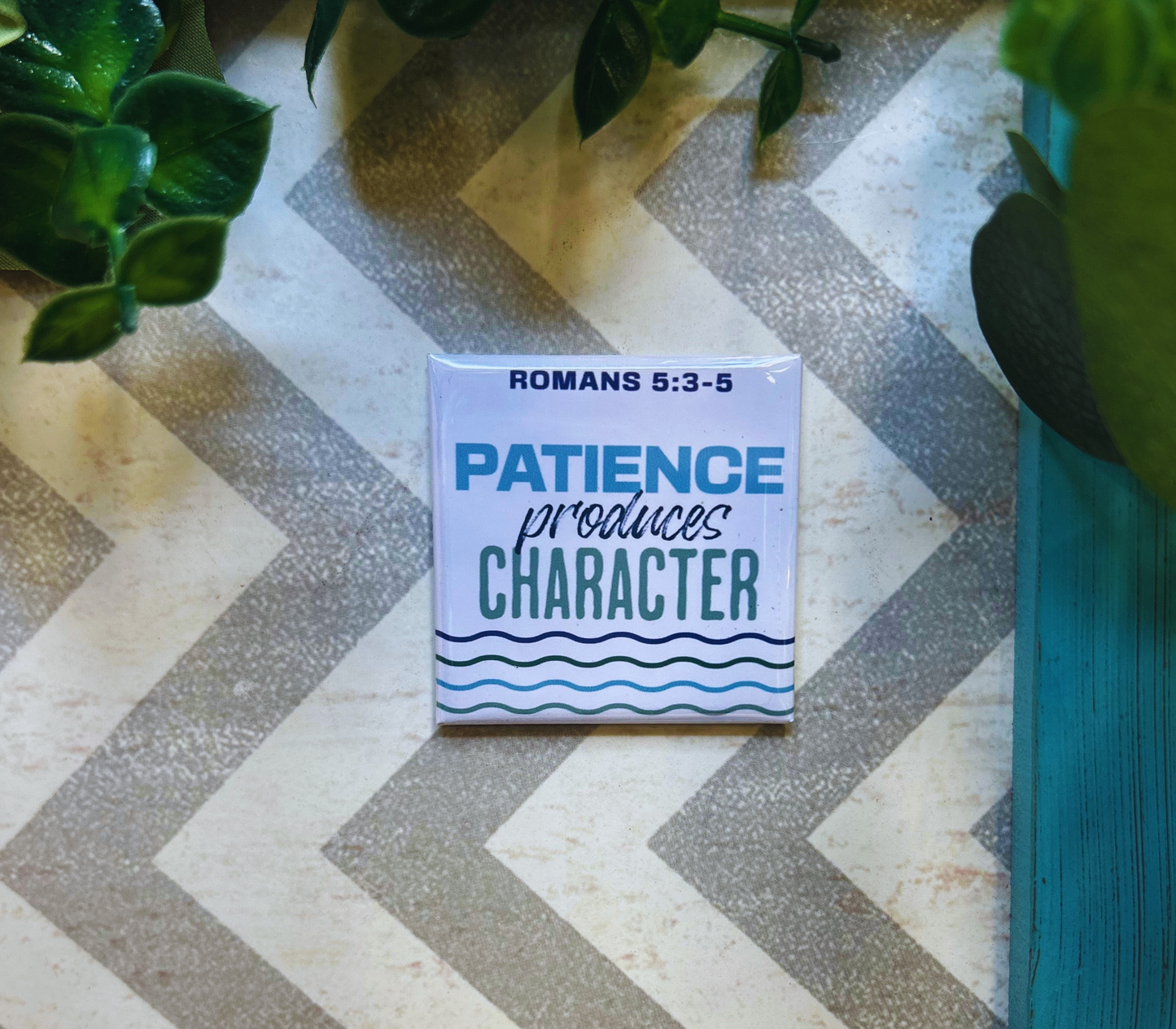 Scripture design drop refrigerator magnet with 'Patience produces character' text.