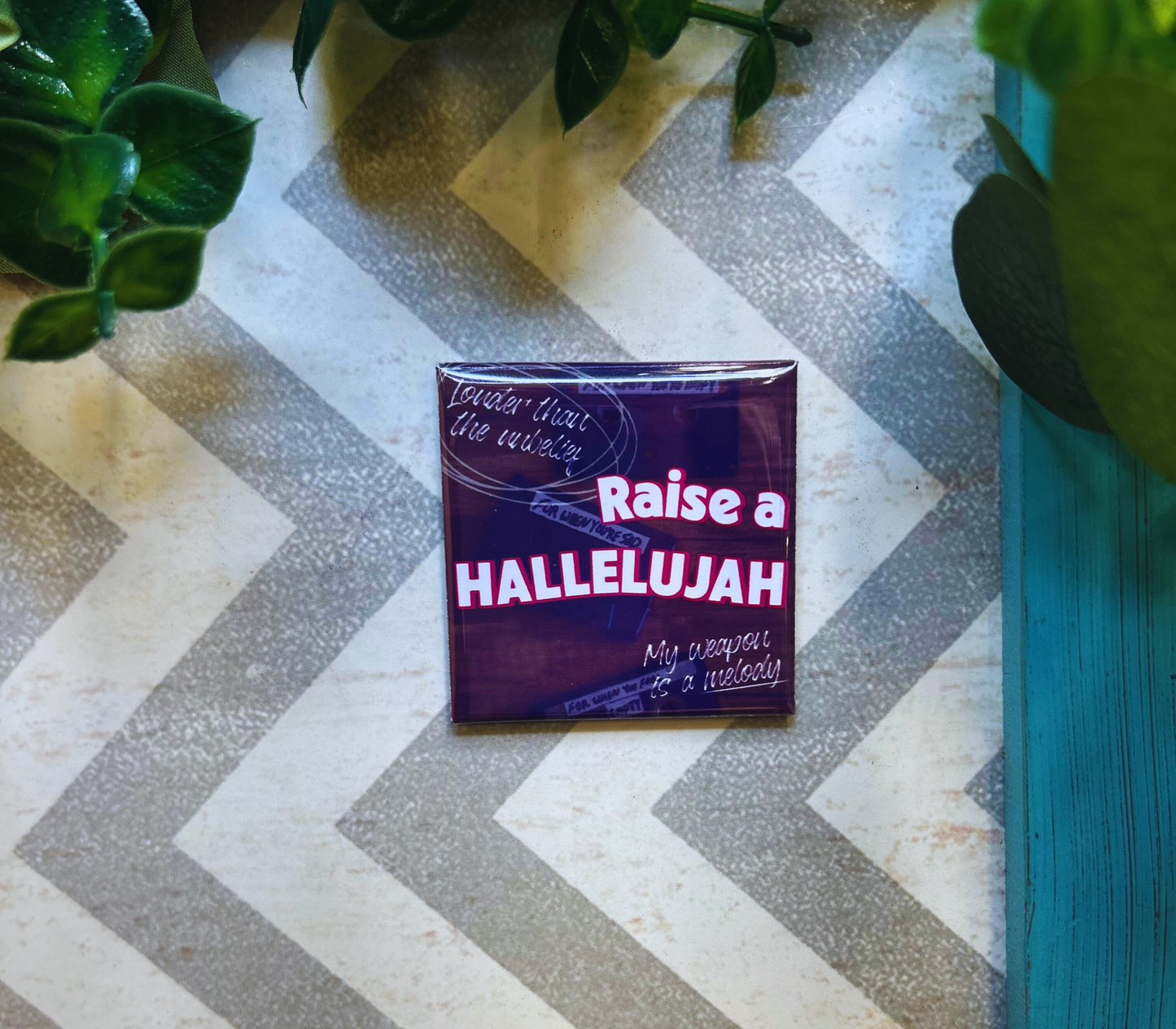 Scripture design drop refrigerator magnet with 'Raise a Hallelujah' text.